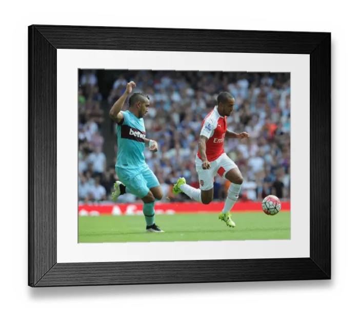 Framed Print : Theo Walcott vs Dimitri Payet: A Premier League Showdown at the Emirates