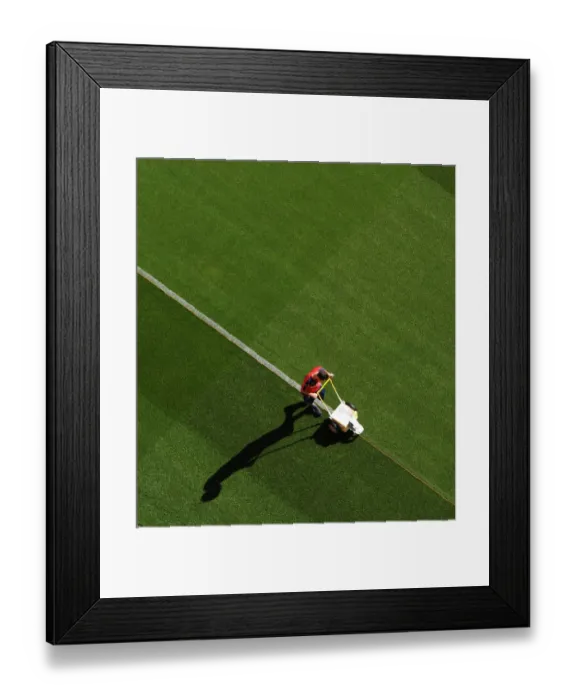 Framed Print : Preparing the Emirates Turf: Arsenal vs West Ham United, Premier League Showdown