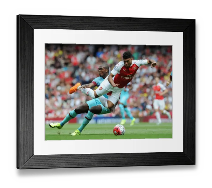 Framed Print : Oxlade-Chamberlain vs. Ogbonna: Intense Clash Between Arsenal's Winger and West Ham's Defender in 2015-16 Premier League Framed Print : Oxlade-Chamberlain vs. Ogbonna: Intense Clash Between Arsenal's Winger and West Ham's Defender in 2015-16 Premier League