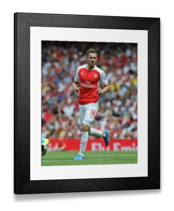 Framed Print : Arsenal's Aaron Ramsey Faces Off Against West Ham United in Intense 2015-16 Premier League Clash