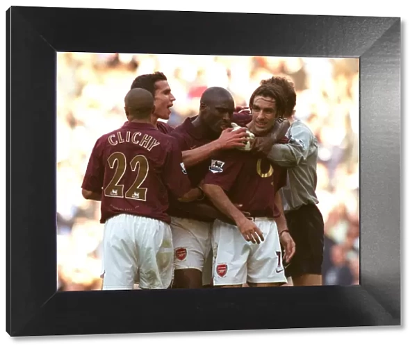Robert Pires celebrates scoring the Arsenal goal with Sol Campbell, Gael Clichy