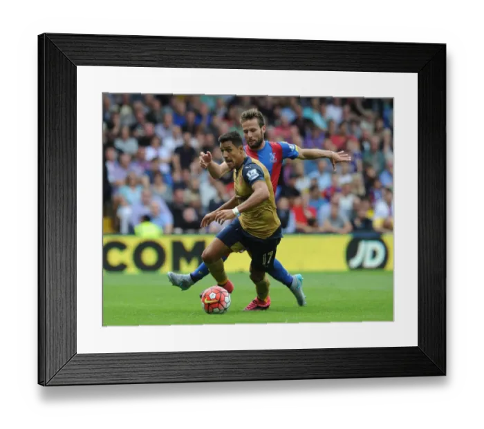 Framed Print : Clash of Stars: Sanchez vs Cabaye - Arsenal's Titans Battle in Crystal Palace's Premier League