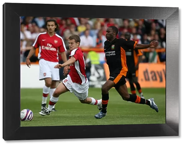 Jack Wilshere Shines: Arsenal's Young Prodigy Outplays Barnet's Justin Cochrane in Pre-Season Friendly