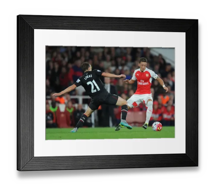 Framed Print : Arsenal vs. Liverpool Showdown: Ozil vs. Leiva Clash in the 2015 / 16 Premier League