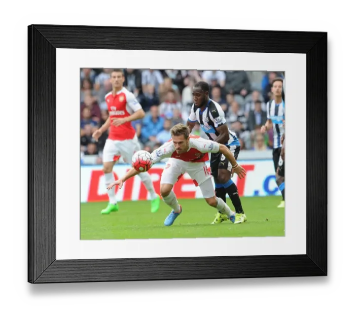 Framed Print : Ramsey Stands Firm: Arsenal Star Holds Off Newcastle's Anita in Intense 2015-16 Premier League Clash