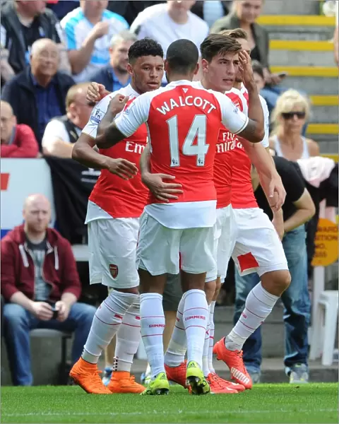 Oxlade-Chamberlain Scores: Walcott and Bellerin Celebrate in Arsenal's Victory over Newcastle United, 2015-16 Premier League