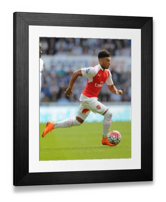 Framed Print : Arsenal's Alex Oxlade-Chamberlain Faces Off Against Newcastle United in Premier League Clash (2015-16)