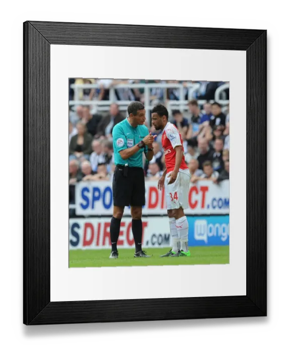 Framed Print : Referee Intervenes in Heated Coquelin-Newcastle Clash during Arsenal vs. Newcastle Match