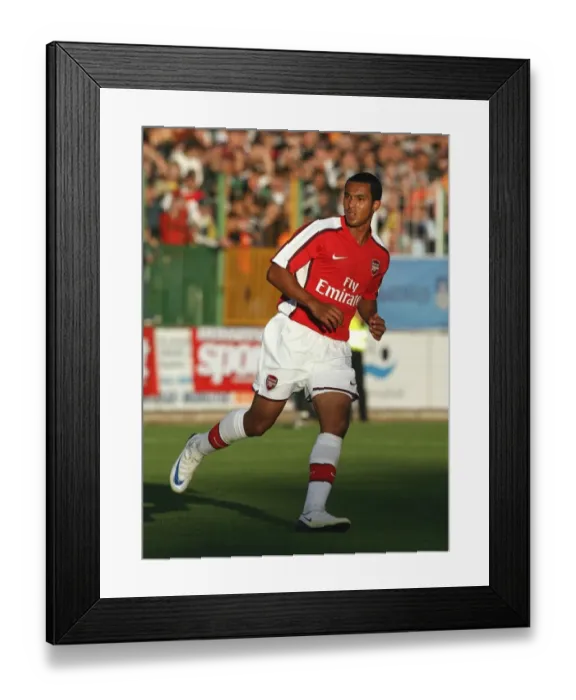 Framed Print : Theo Walcott's Determined Performance: Arsenal vs Szombathely, 2008 - A Hard-Fought 1-1 Draw