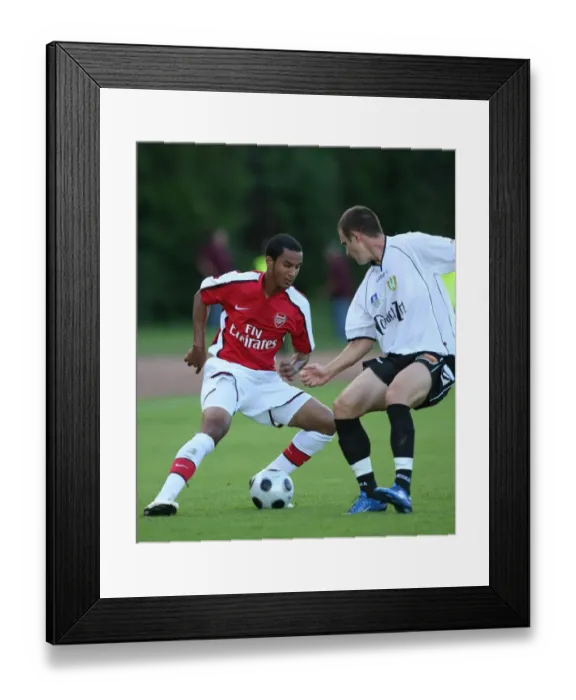 Framed Print : Theo Walcott vs. Zoltan Csontos: Szombathely vs. Arsenal (2008)