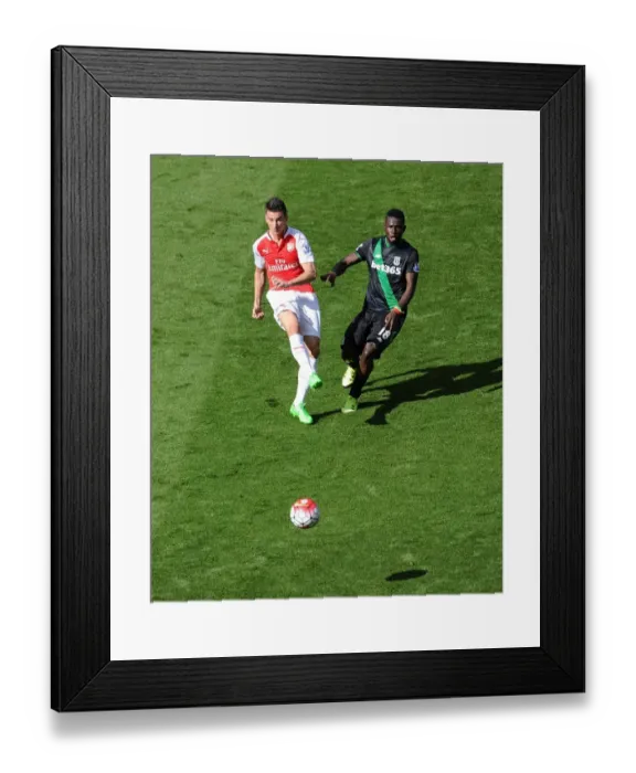 Framed Print : Clash of Titans: Koscielny vs. Diouf in Intense Arsenal-Stoke Battle Framed Print : Clash of Titans: Koscielny vs. Diouf in Intense Arsenal-Stoke Battle