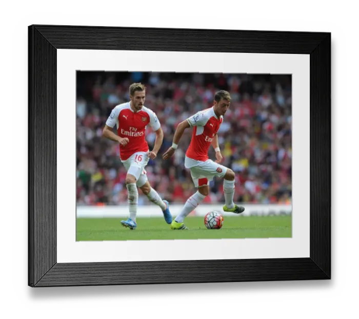 Framed Print : Arsenal's Ozil and Ramsey in Action: A Premier League Duo at their Best (Arsenal v Stoke City 2015-16)