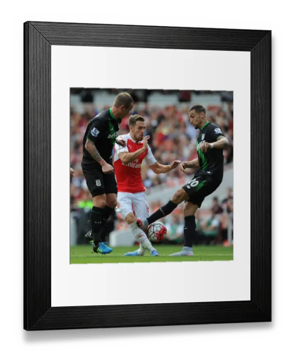 Framed Print : Ramsey vs. Cameron: Intense Face-Off in Arsenal's Clash Against Stoke City Framed Print : Ramsey vs. Cameron: Intense Face-Off in Arsenal's Clash Against Stoke City