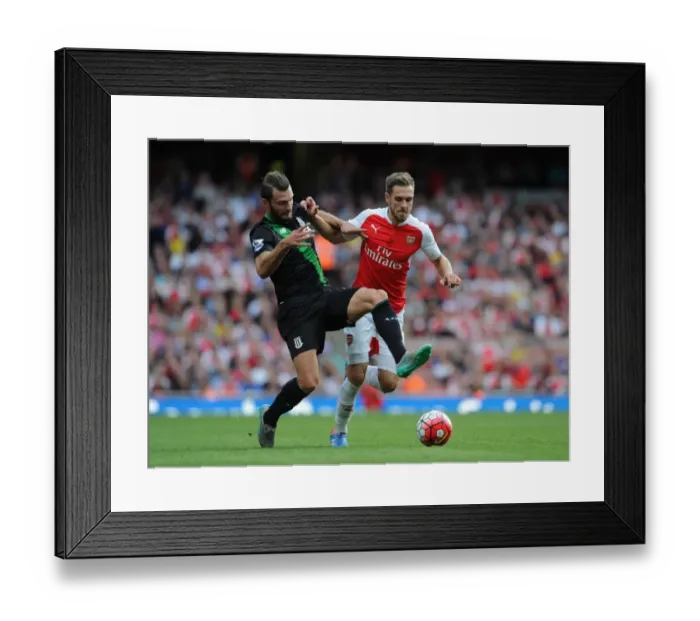 Framed Print : Ramsey vs Pieters: Intense Face-Off in Arsenal vs Stoke Premier League Clash
