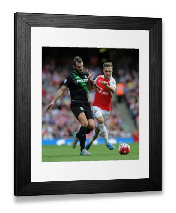 Framed Print : Intense Showdown: Ramsey vs. Pieters in Arsenal's Battle Against Stoke