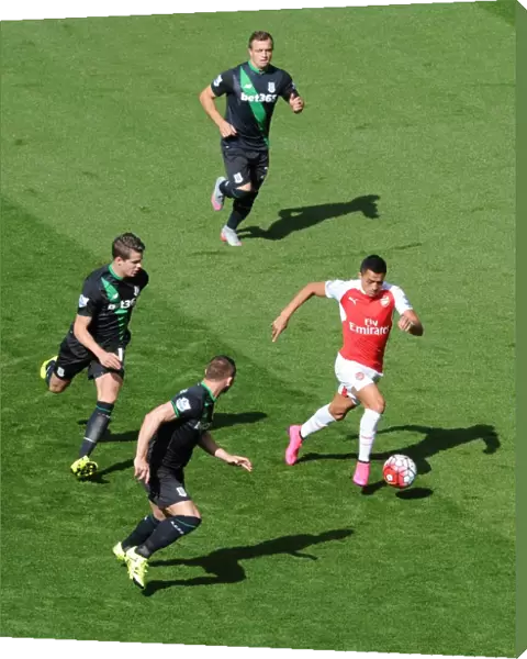 Alexis Sanchez (Arsenal) takes on Xherdan Shaqiri, Marco van Ginkel and Phil Bardsley