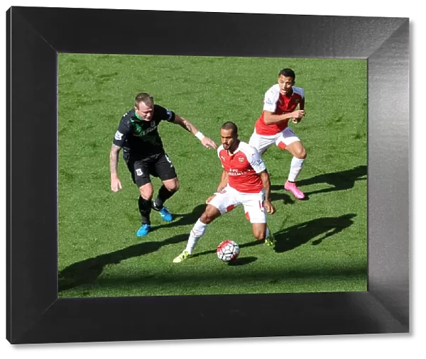 Theo Walcott and Alexis Sanchez (Arsenal) Glen Whelan (Stoke). Arsenal 2: 0 Stoke City