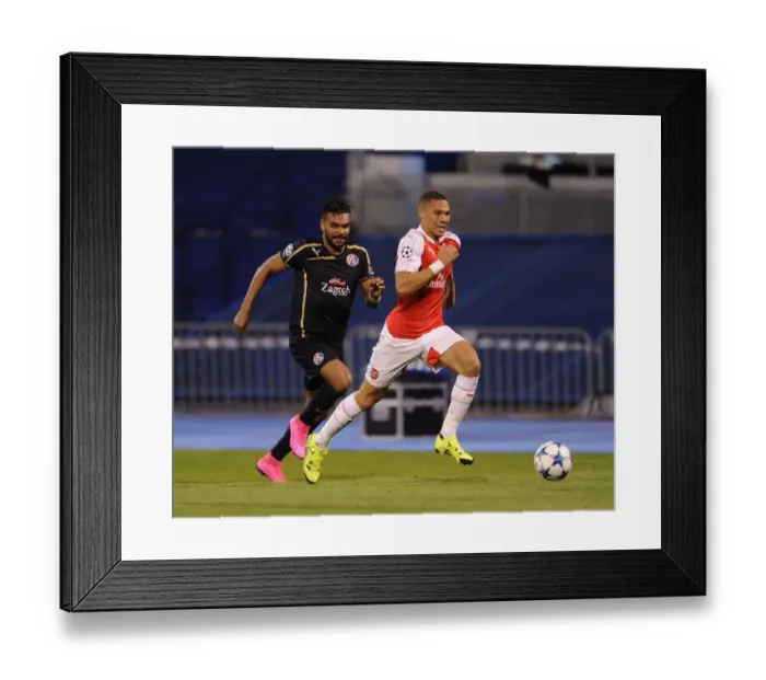 Framed Print : Clash of Champions: Kieran Gibbs vs El Arabi Hilal Soudani - A Battle at the Heart of Dinamo Zagreb vs Arsenal (2015-16)