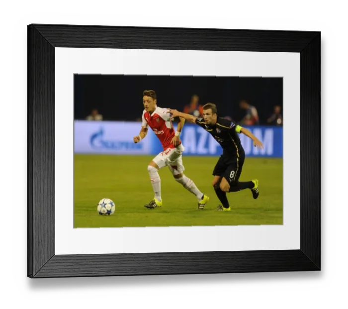 Framed Print : Mesut Ozil vs. Domagoj Antolic: Tense Clash in Dinamo Zagreb vs. Arsenal UEFA Champions League Match, 2015