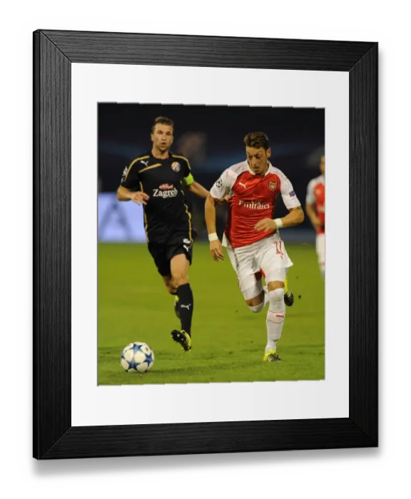 Framed Print : Mesut Ozil Slices Through Dinamo Zagreb's Defense in UEFA Champions League Showdown Framed Print : Mesut Ozil Slices Through Dinamo Zagreb's Defense in UEFA Champions League Showdown