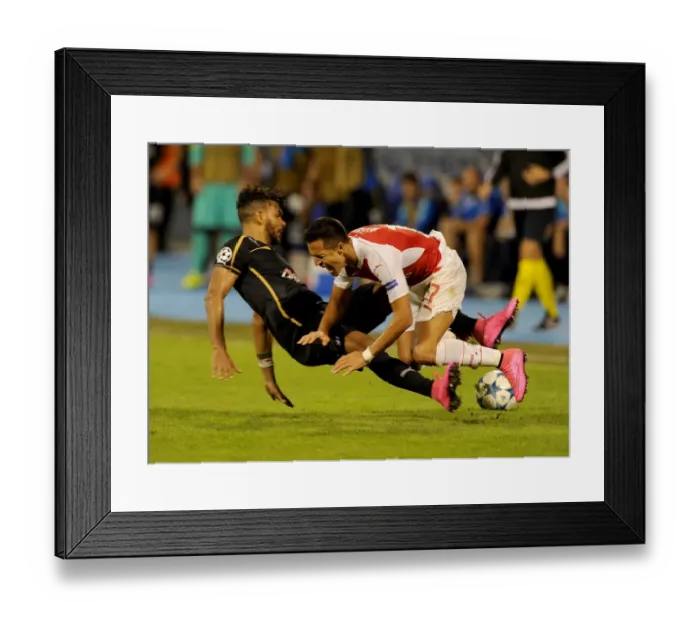 Framed Print : Alexis Sanchez vs El Arabi Hilal Soudani: Foul in Dinamo Zagreb vs Arsenal UEFA Champions League Match