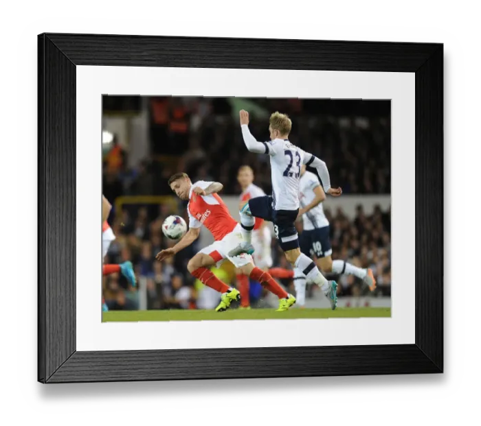 Framed Print : Clash of Rivals: Debuchy vs. Eriksen in the Capital One Cup Battle of London