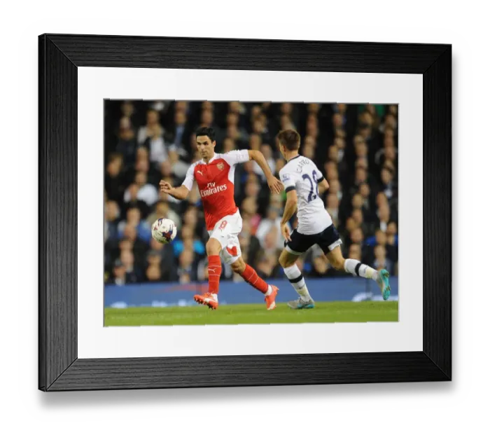 Framed Print : Clash of Midfield Titans: Arteta vs. Carroll in the Capital One Cup
