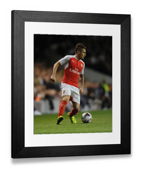 Framed Print : Mathieu Debuchy (Arsenal). Tottenham Hotspur 1: 2 Arsenal. Capital One Cup. 3rd Round