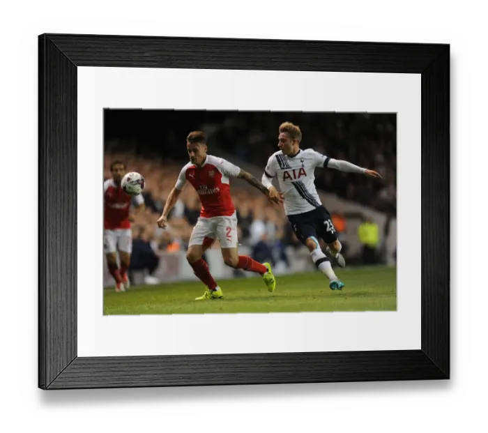 Framed Print : Intense Battle: Debuchy vs. Eriksen in the Capital One Cup Clash Between Tottenham and Arsenal Framed Print : Intense Battle: Debuchy vs. Eriksen in the Capital One Cup Clash Between Tottenham and Arsenal
