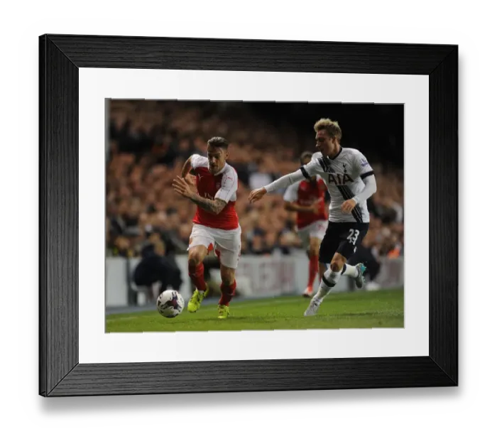 Framed Print : Intense Rivalry: Debuchy vs. Eriksen in the Battle of the Capital One Cup: Tottenham vs. Arsenal