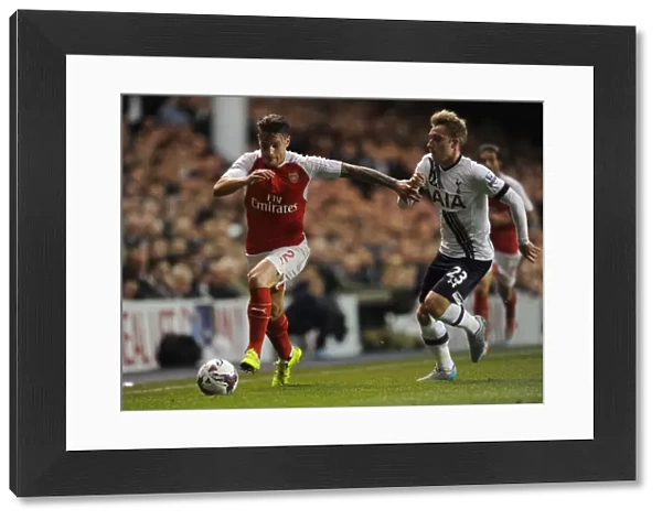 Intense Rivalry: Debuchy vs. Eriksen in the Capital One Cup Showdown between Arsenal and Tottenham