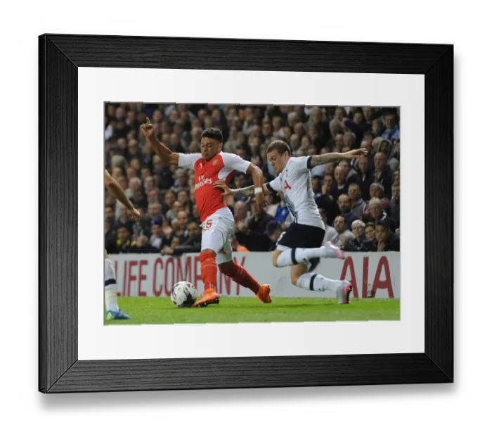 Framed Print : Clash of Wings: Oxlade-Chamberlain vs. Trippier in the Intense Battle of the Capital One Cup Framed Print : Clash of Wings: Oxlade-Chamberlain vs. Trippier in the Intense Battle of the Capital One Cup