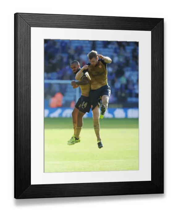 Framed Print : Arsenal's Triumph Over Leicester City in the 2015 / 16 Premier League: Theo Walcott and Per Mertesacker Celebrate Framed Print : Arsenal's Triumph Over Leicester City in the 2015 / 16 Premier League: Theo Walcott and Per Mertesacker Celebrate