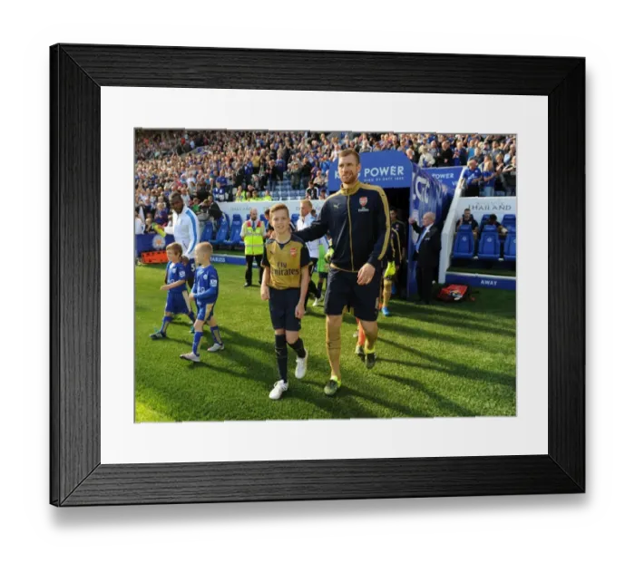 Framed Print : Per Mertesacker Leads Arsenal Against Leicester City in Premier League Showdown, 2015