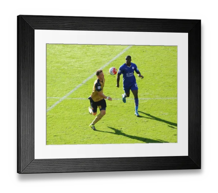 Framed Print : Mesut Ozil vs. Jeffrey Schlupp: A Football Battle at Leicester City vs. Arsenal Framed Print : Mesut Ozil vs. Jeffrey Schlupp: A Football Battle at Leicester City vs. Arsenal