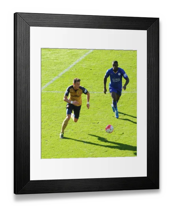 Framed Print : Mesut Ozil vs Jeffrey Schlupp: A Premier League Showdown Framed Print : Mesut Ozil vs Jeffrey Schlupp: A Premier League Showdown