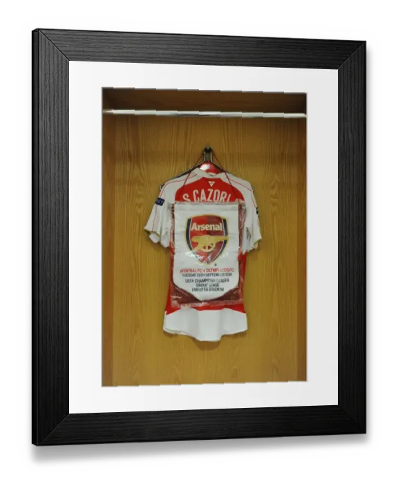 Framed Print : Santi Cazorla's Arsenal FC Changing Room: Shirt and Match Pennant (Arsenal vs. Olympiacos, UEFA Champions League, 2015 / 16) Framed Print : Santi Cazorla's Arsenal FC Changing Room: Shirt and Match Pennant (Arsenal vs. Olympiacos, UEFA Champions League, 2015 / 16)