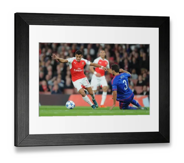 Framed Print : Arsenal's Alexis Sanchez vs. Olympiacos Alberto Botia: A Fierce Face-Off in the 2015 / 16 Champions League