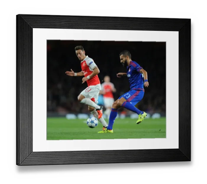 Framed Print : Mesut Ozil vs. Dimitris Siovas: Arsenal vs. Olympiacos Clash in 2015 / 16 UEFA Champions League Framed Print : Mesut Ozil vs. Dimitris Siovas: Arsenal vs. Olympiacos Clash in 2015 / 16 UEFA Champions League