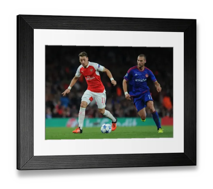 Framed Print : Arsenal vs. Olympiacos: Ozil vs. Kasami Clash in the 2015 / 16 UEFA Champions League