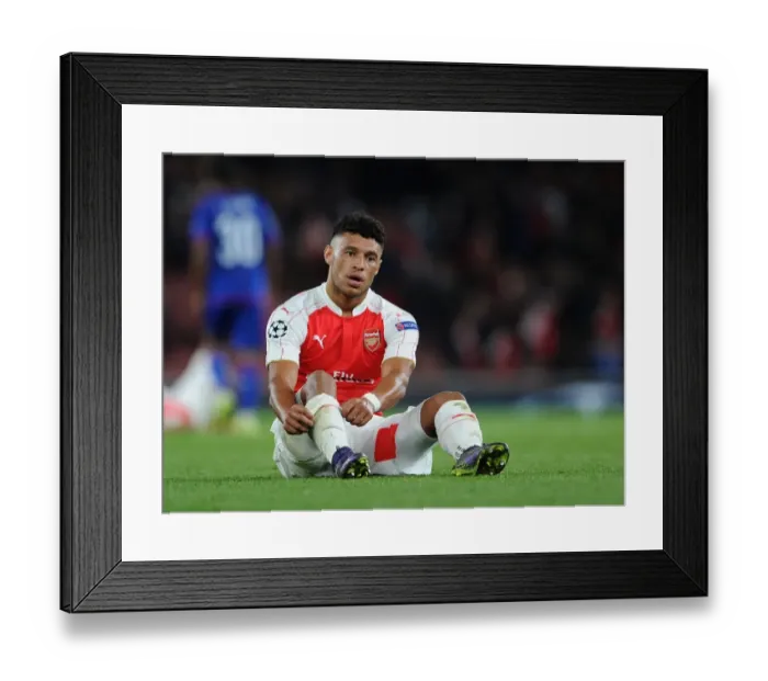 Framed Print : Alex Oxlade-Chamberlain's Euphoric Reaction: Arsenal's UEFA Champions League Triumph over Olympiacos (2015 / 16)