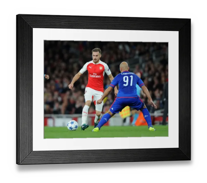Framed Print : Ramsey's Slick Moves: Outmaneuvering Cambiasso in Arsenal's 2015 Champions League Battle Framed Print : Ramsey's Slick Moves: Outmaneuvering Cambiasso in Arsenal's 2015 Champions League Battle