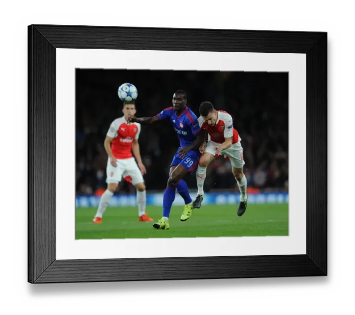 Framed Print : Koscielny Defends: Arsenal vs Olympiacos in Champions League Framed Print : Koscielny Defends: Arsenal vs Olympiacos in Champions League