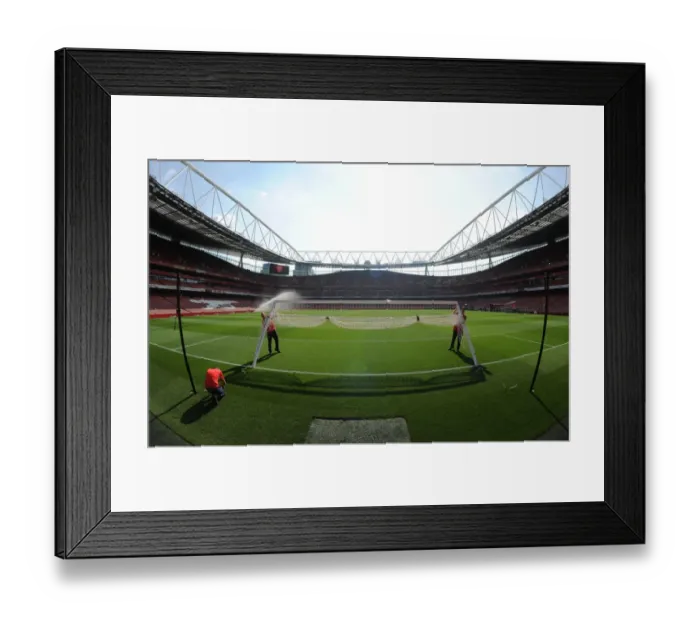 Framed Print : Arsenal vs Manchester United: Preparing the Turf for Premier League Battle