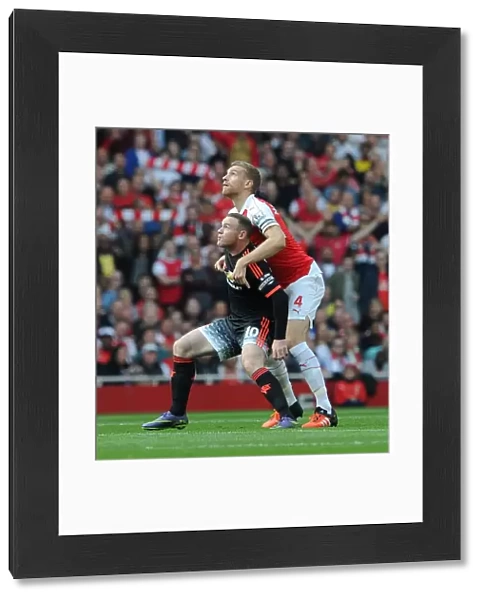 Per Mertesacker (Arsenal) Wayne Rooney (Man Utd)