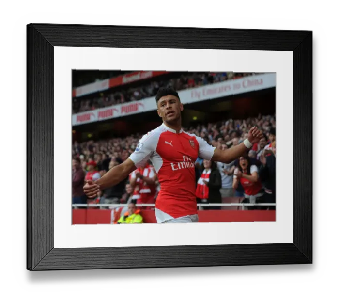 Framed Print : Arsenal's Oxlade-Chamberlain Goes Head-to-Head with Manchester United in Premier League Clash