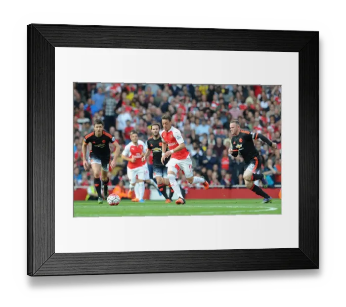 Framed Print : Mesut Ozil's Brilliance: Arsenal's 3-0 Triumph over Manchester United, 2015