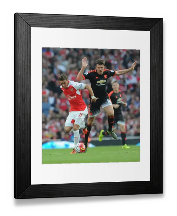 Framed Print : Mesut Ozil vs Michael Carrick: A Midfield Battle - Arsenal vs Manchester United (2015 / 16)