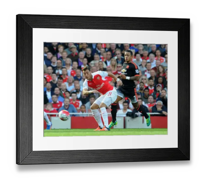 Framed Print : Mesut Ozil vs Memphis Depay: A Premier League Showdown at Arsenal Framed Print : Mesut Ozil vs Memphis Depay: A Premier League Showdown at Arsenal