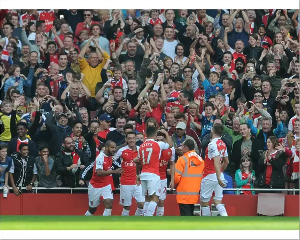 Mesut Ozil celebrates Arsenals 2nd goal with his team mates